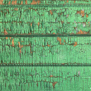 Yıpranmış boya desenli ahşap bir duvar.