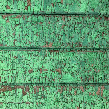 Yıpranmış boya desenli ahşap bir duvar.