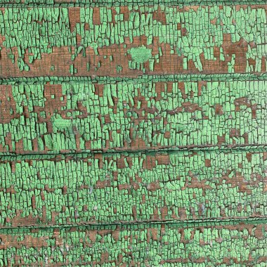 Yıpranmış boya desenli ahşap bir duvar.