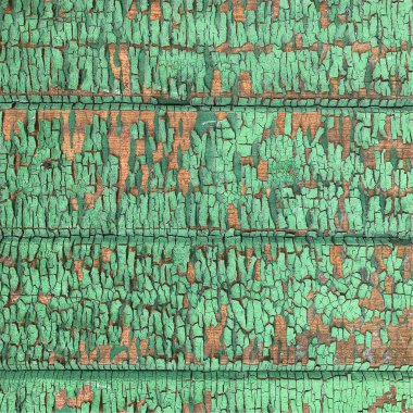 Yıpranmış boya desenli ahşap bir duvar.