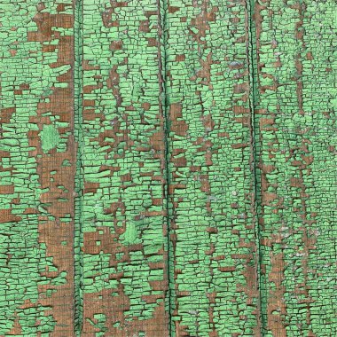 Yıpranmış boya desenli ahşap bir duvar.