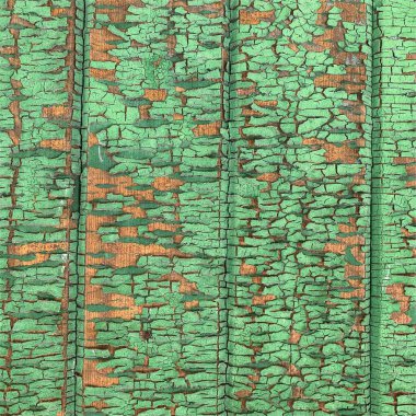 Yıpranmış boya desenli ahşap bir duvar.