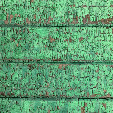 Yıpranmış boya desenli ahşap bir duvar.