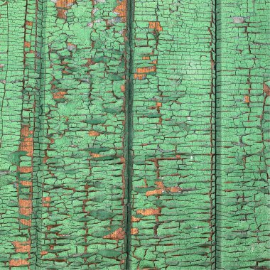 Yıpranmış boya desenli ahşap bir duvar.