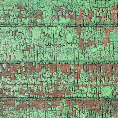 Yıpranmış boya desenli ahşap bir duvar.