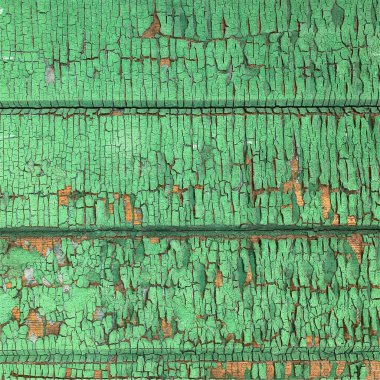 Yıpranmış boya desenli ahşap bir duvar.