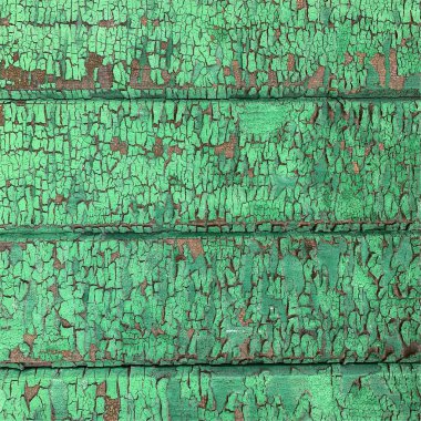 Yıpranmış boya desenli ahşap bir duvar.