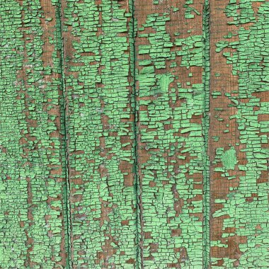 Yıpranmış boya desenli ahşap bir duvar.