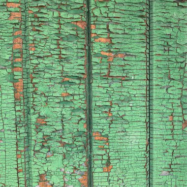 Yıpranmış boya desenli ahşap bir duvar.