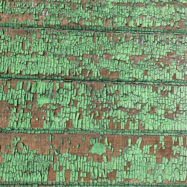 Yıpranmış boya desenli ahşap bir duvar.