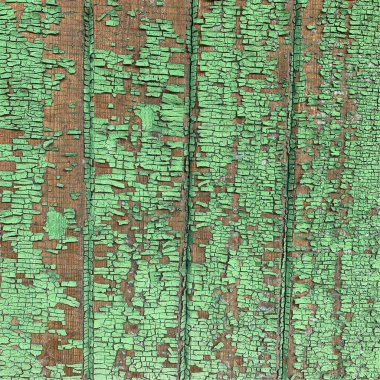 Yıpranmış boya desenli ahşap bir duvar.