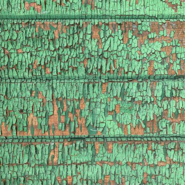 Yıpranmış boya desenli ahşap bir duvar.