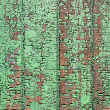 Yıpranmış boya desenli ahşap bir duvar.