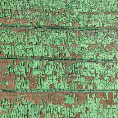 Yıpranmış boya desenli ahşap bir duvar.