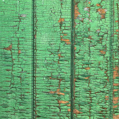 Yıpranmış boya desenli ahşap bir duvar.