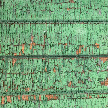 Yıpranmış boya desenli ahşap bir duvar.