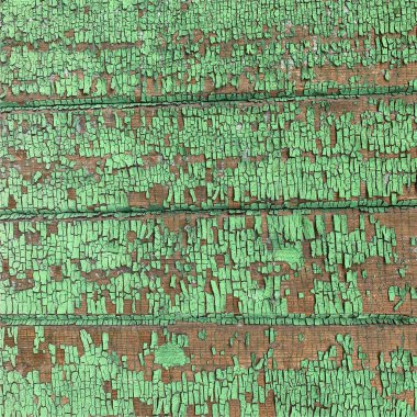 Yıpranmış boya desenli ahşap bir duvar.