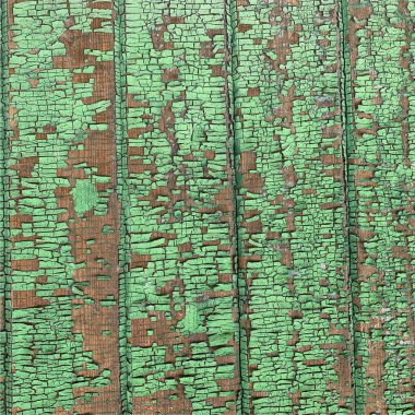 Yıpranmış boya desenli ahşap bir duvar.