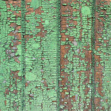 Yıpranmış boya desenli ahşap bir duvar.