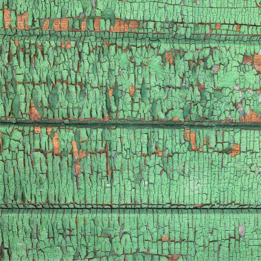 Yıpranmış boya desenli ahşap bir duvar.