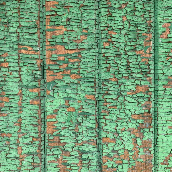 Yıpranmış boya desenli ahşap bir duvar.