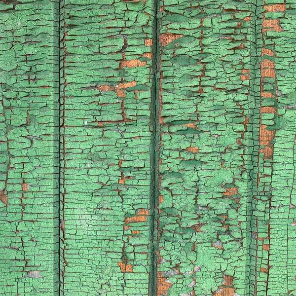 Yıpranmış boya desenli ahşap bir duvar.