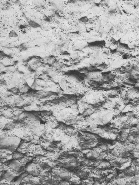 Çatlak, engebeli bir duvar. Orijinal yaşlandırılmış tek renkli arkaplan.