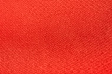 Kırmızı saten tekstil dokusuna yakın çekim. Güzel kırmızı ipek arka plan, kırmızı arkaplan ve sevgililer günü arkaplanı. kırmızı renk ipeği