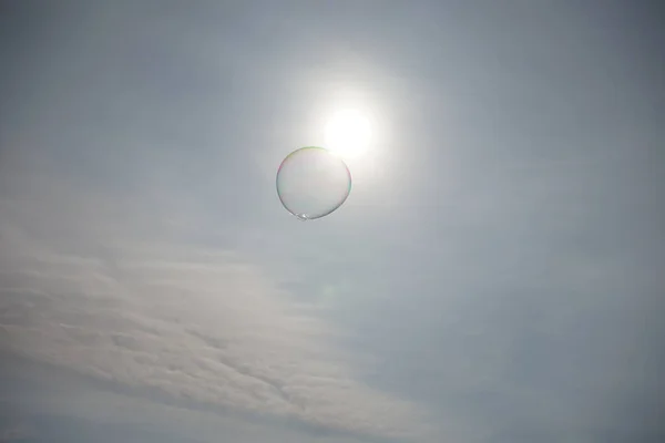 soap bubble in the sky in front of the sun