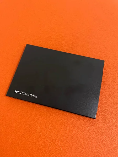 Black Solid State Drive Ssd Close View Orange Background Focus — Stock Fotó