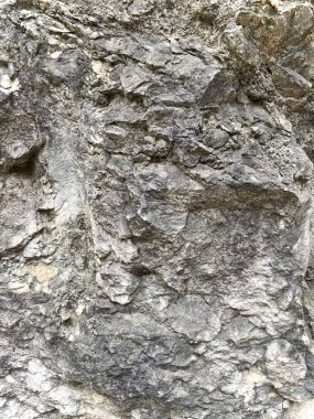 Granit taş duvarın bulanık arkaplanı, taş dokusunu kapat