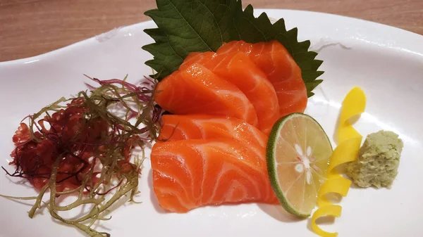 Stock image Salmon raw fillet fish sliced japanese sashimi alacarte foods menu on white plate delicious meal