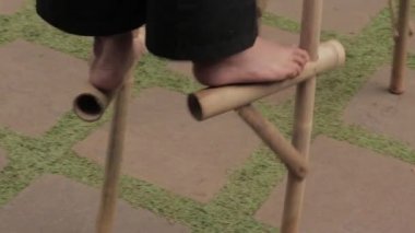 Egrang, A Traditional Game from Indonesia Using Pair of Bamboo to Conquer Balance Steps Played by Indonesian Boys