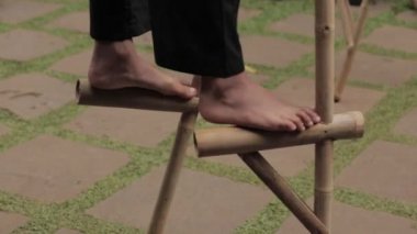 Egrang, A Traditional Game from Indonesia Using Pair of Bamboo to Conquer Balance Steps Played by Indonesian Boys