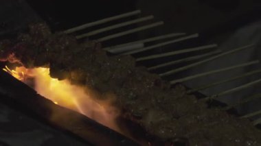 Close Up Charcoal Grilling Indonesian Chicken Pork Beef Satay Sate with Peanut Sauce