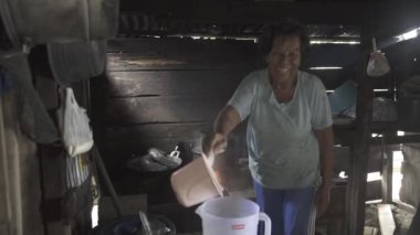 Indonesian Mother Woman Cooking in her Traditional Kitchen