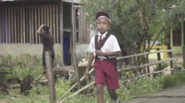 Portrait of Indonesian Elementary School Student with White and Red Uniform Hat Indonesia