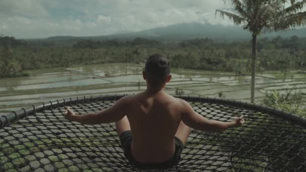 Man Healing Yoga Meditation Facing Mountain Green Rice Field Slow — Stock video