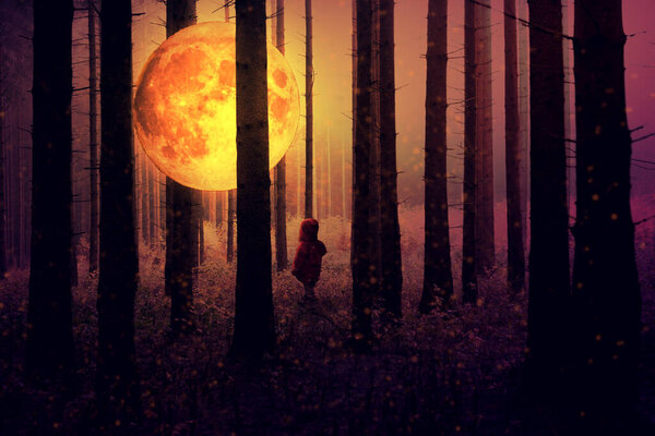 Girl silhouette in forest at night with bright moon