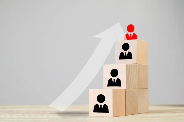 Human resources talent management and recruitment business building team, organization concept, Person icons on wooden cube block on top with arrows pointing to leadership, Copyspace