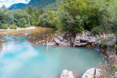 Long exposure picture of emerald Soca (also known as Isonzo) River Valley at Julian Alps in Bovec, Slovenia