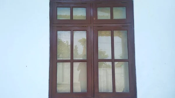 A closed wooden window in a minimalist style