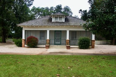Plains, Georgia: Jimmy Carter National Historic Site. A front exterior view of the Carter Boyhood Home in Archery, Georgia. Earl and Lillian Carter's farmhouse screened front porch.