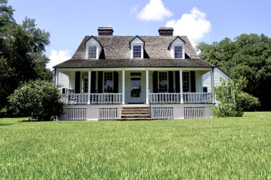 Charles Pinckney National Historic Site, Mount Pleasant, South Carolina - Preserves Charles Pinckney's Snee Farm plantation and country retreat. The Coastal Cottage with full-width front porch.  clipart