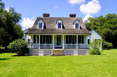 Charles Pinckney National Historic Site, Mount Pleasant, South Carolina - Preserves Charles Pinckney's Snee Farm plantation and country retreat. The Coastal Cottage with full-width front porch.  clipart