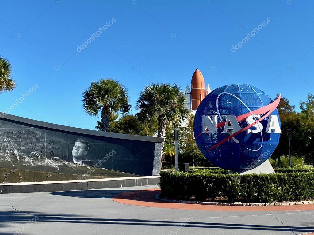 Kennedy Space Center, Florida, USA: Entry Plaza with John F Kennedy Fountain, Blue NASA Logo Sphere, Space Shuttle Atlantis external tank and solid rocket boosters.