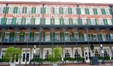 Savannah, Georgia: The Marshall House. Savannah's oldest operating hotel was Union Army hospital during the American Civil War. Iron veranda on second floor. Has reputation of being haunted. clipart