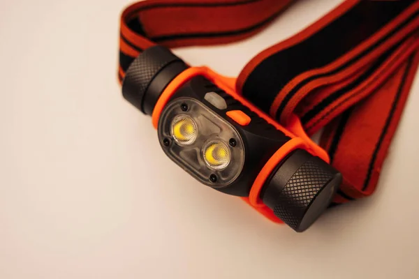 Modern LED powerful rechargeable headlamp with adjustable strap — Stockfoto