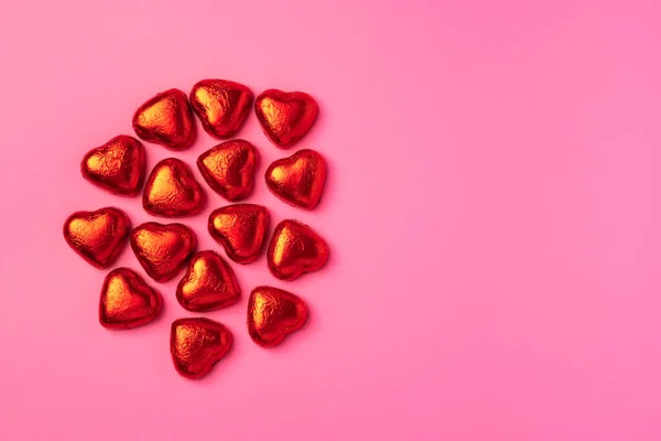 Bright Festive Elegant Pink Background Shiny Candies Shape Hearts Wrapped Royalty Free Stock Images