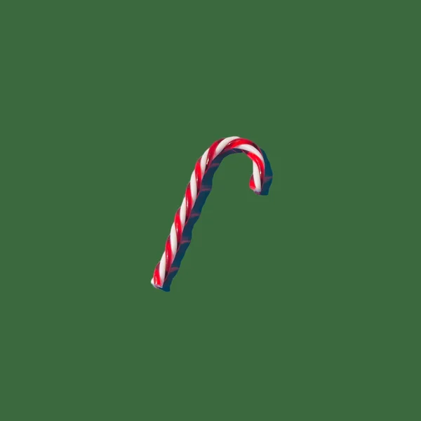 Pastel yeşil arka planda lolipop çubuk şeker. Yaratıcı düzen. Düz yerde, üst tarafta. Yeni yıl ve Noel fikri. En az kış tatili konsepti.